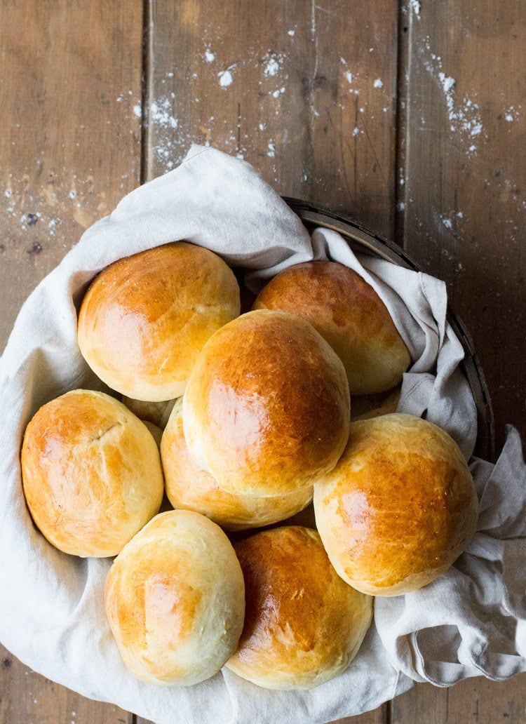 Flatlay of sweet rolls in a basket. Wooden background. Horizontal.