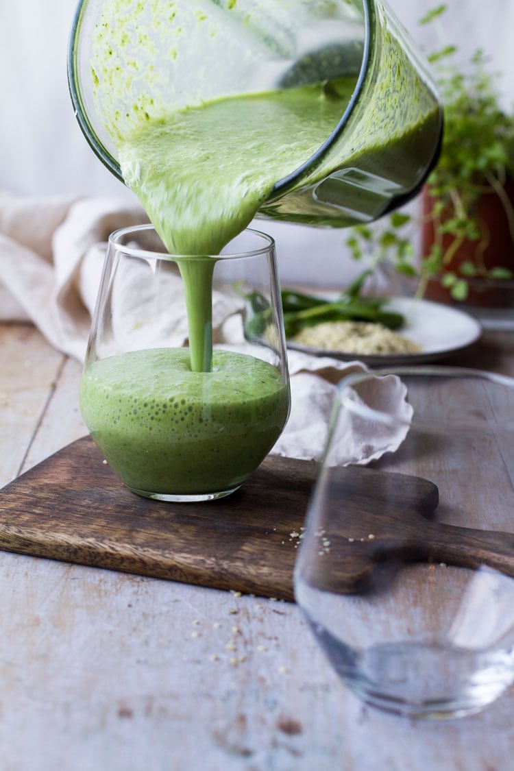 Green Smoothie pouring into glass.