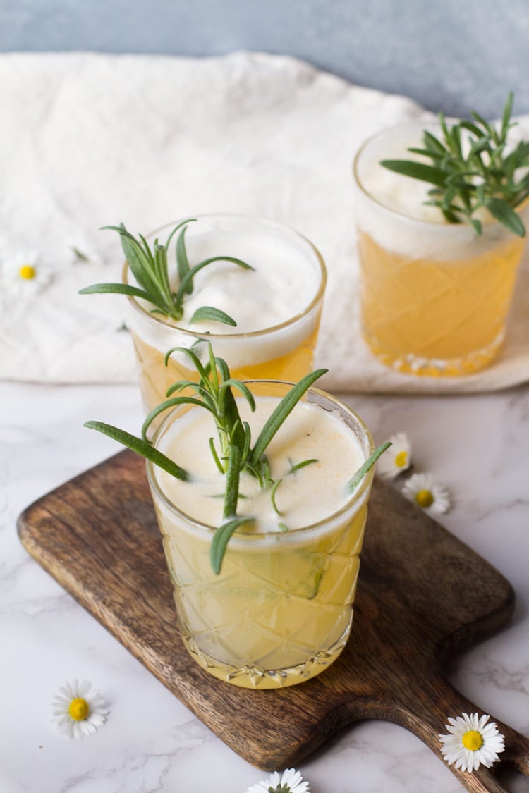 Three apricot rosemary gin fizzes