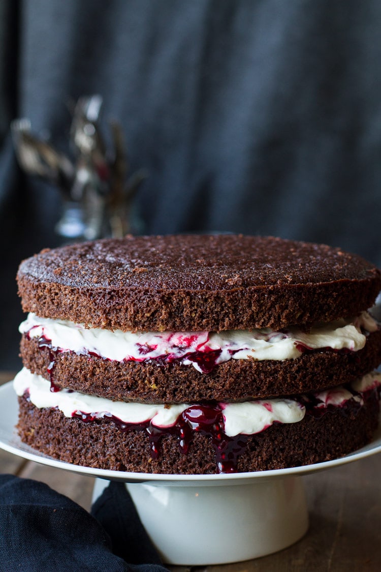 Cherry chocolate cake with two layers of whipped cream and cherry filling.