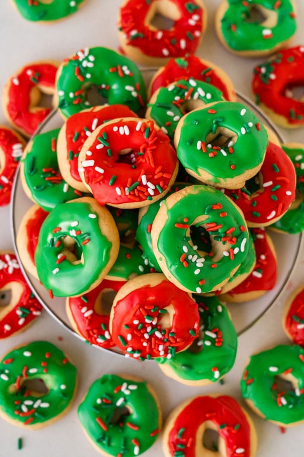 Sugar cookies decorated as donuts with green and red glazing.