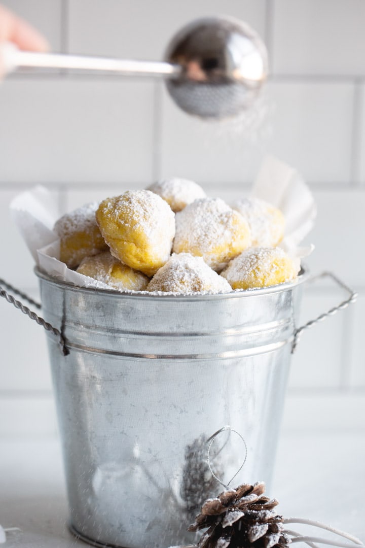 Lemon Snowball cookies in a metal bucket.