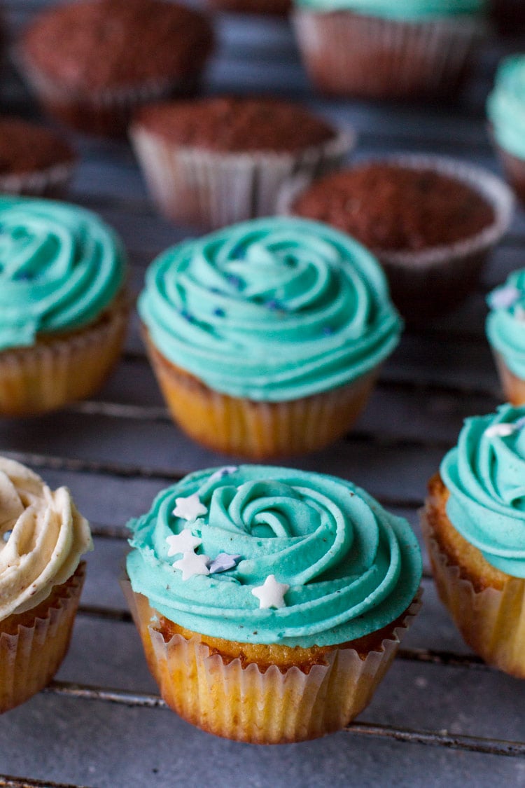 Cupcakes with turquoise buttercream frosting and sprinkles.