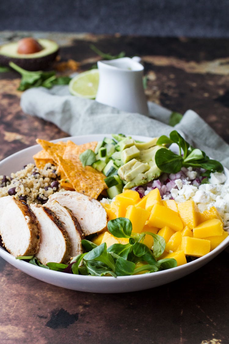 Loaded Mexican salad with mango, chicken, tortilla chips and quinoa.