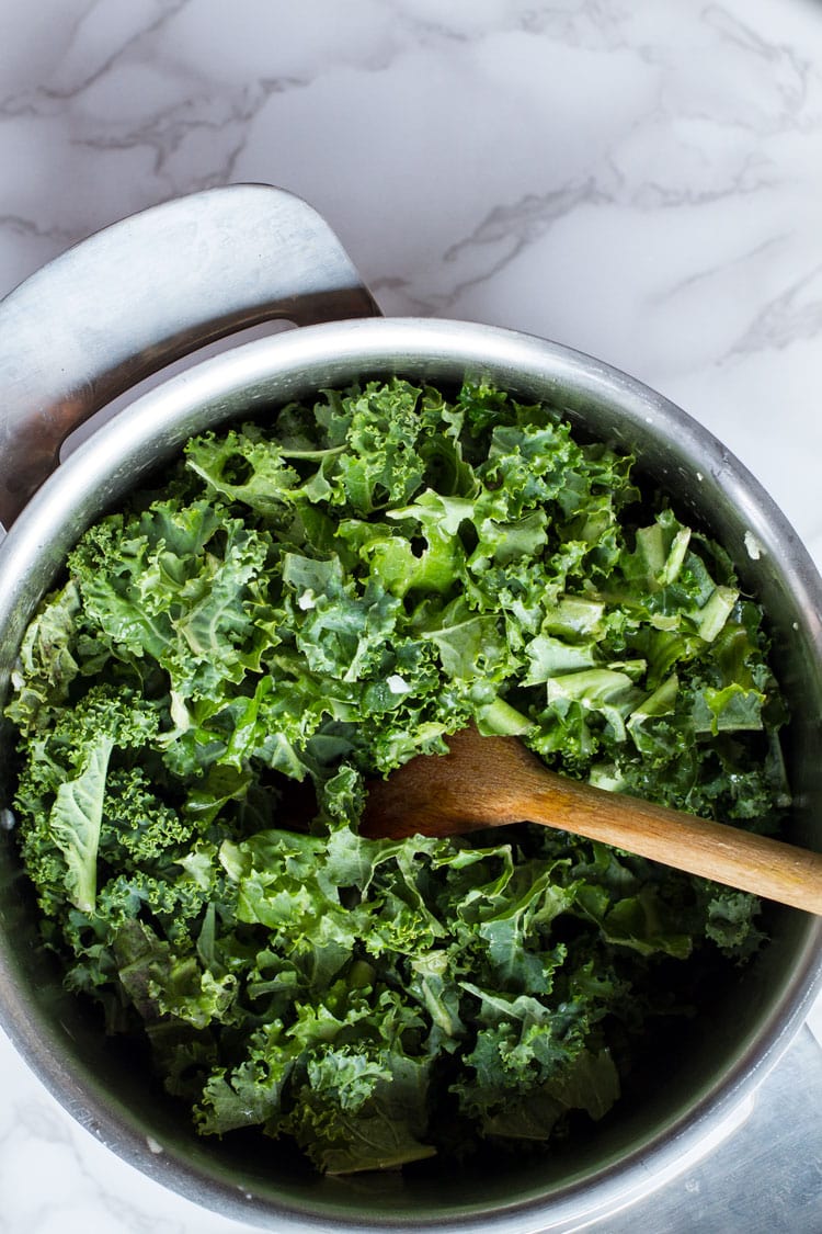 A casserole with kale before it's sauteed.