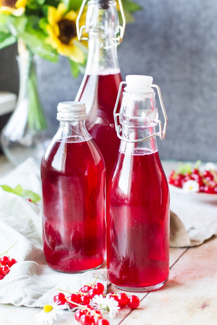 Three bottles of red currant cordial.