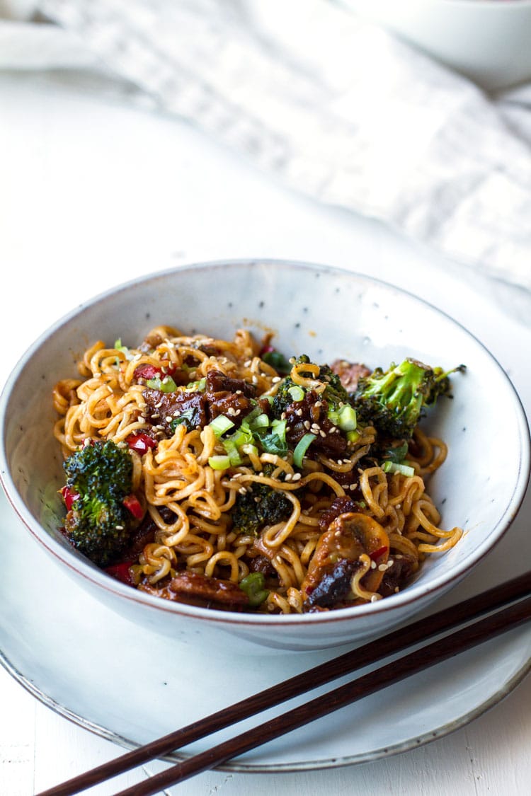 Stir fry noodles and broccoli in a bowl.