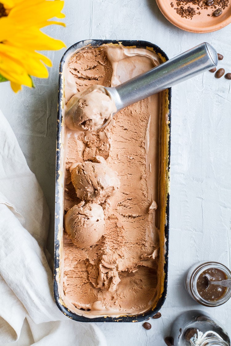 Chocolate ice cream in a bread pan, some scoops.