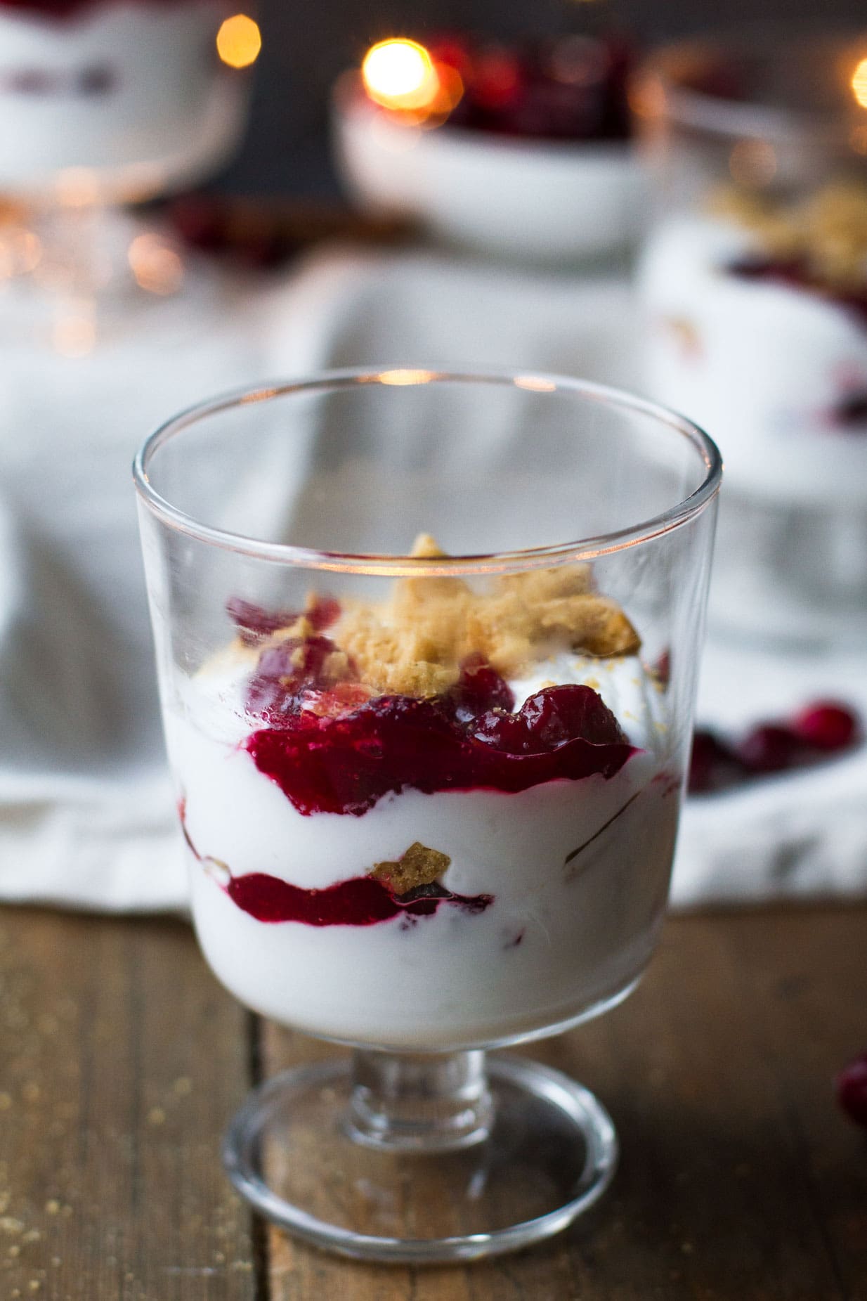 A dessert glass with cranberry coconut trifle.