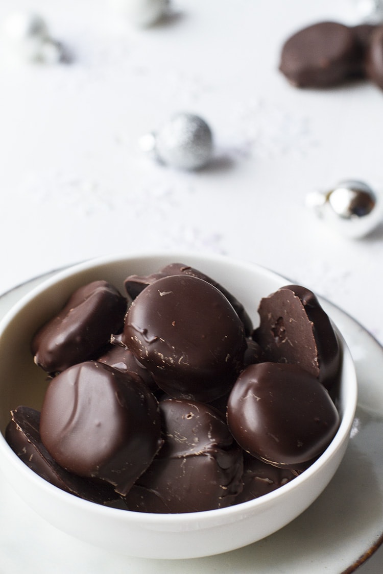 White bowl with peppermint patties.