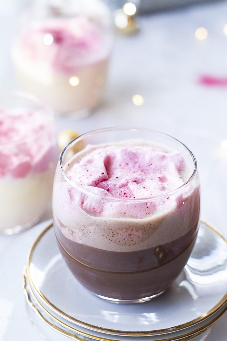 Chocolate eggnog topped with pink fluffy egg whites.
